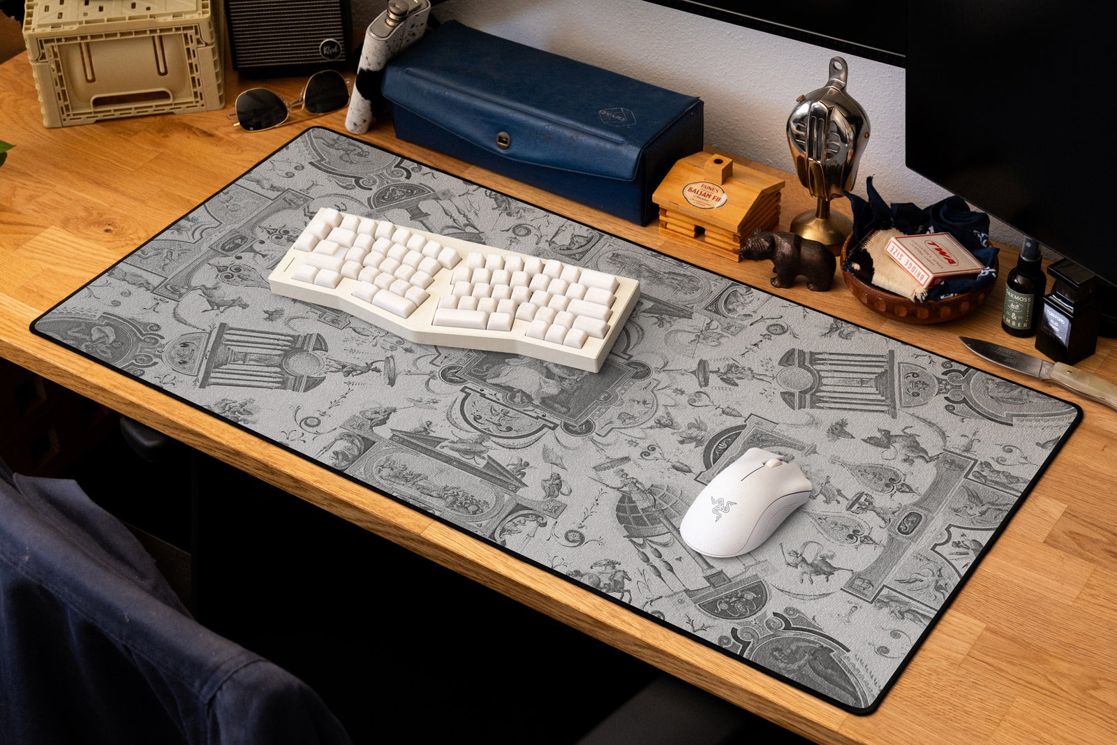 Fortitude desk mat in Dark, shown on a styled desk setup