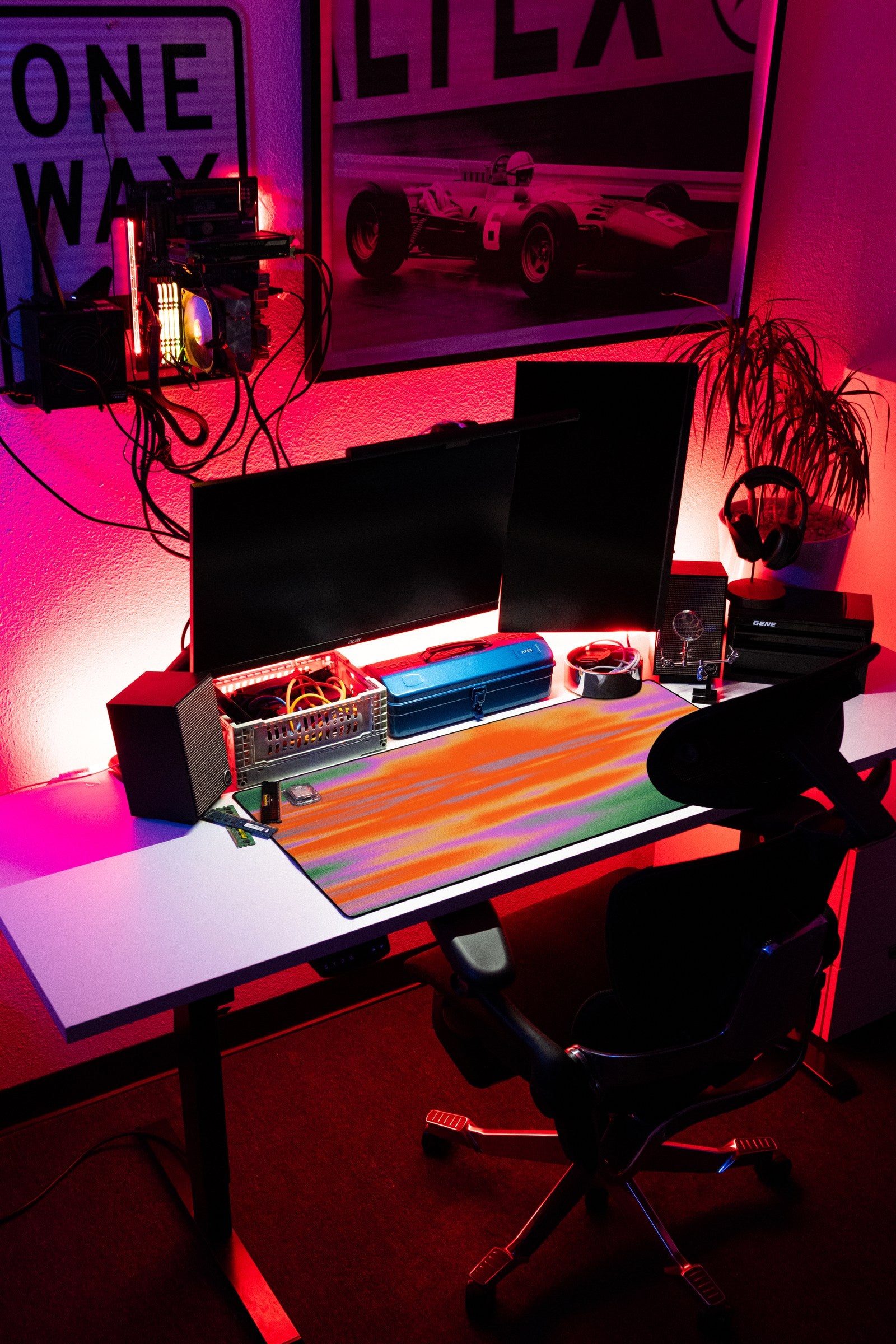 Glare desk mat in Mango Pulse, shown on a styled desk setup