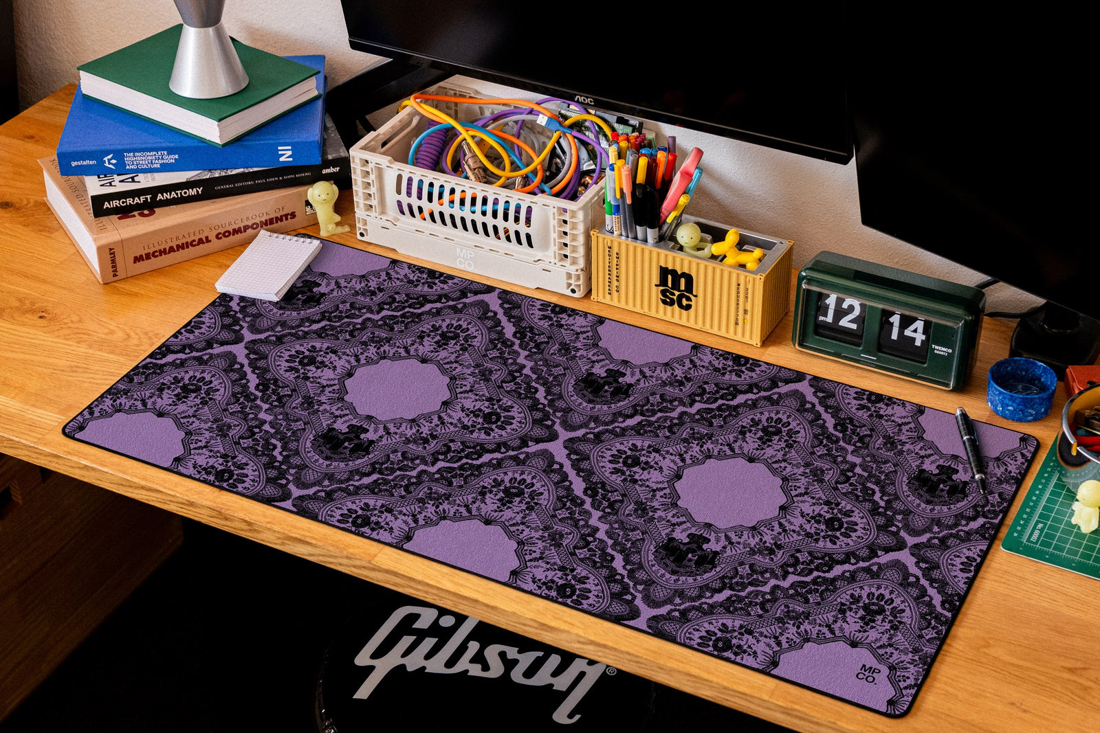 Gothic Diamonds desk mat in Purple, shown on a styled desk setup