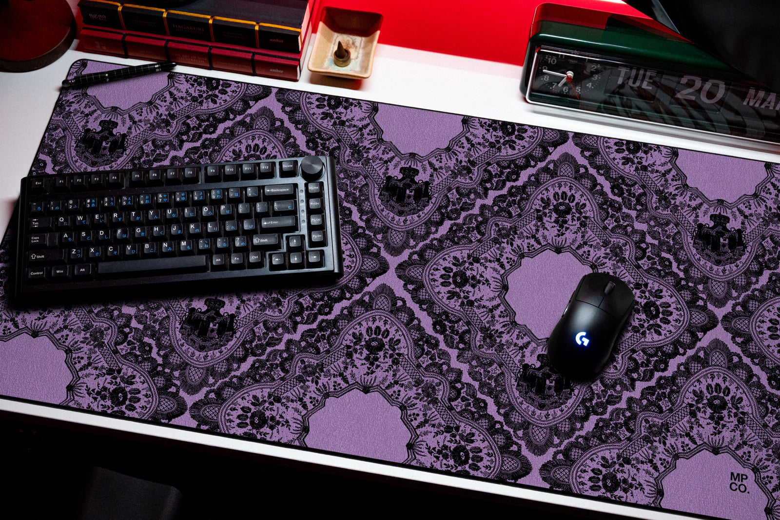 Gothic Diamonds desk mat in Purple, shown on a styled desk setup