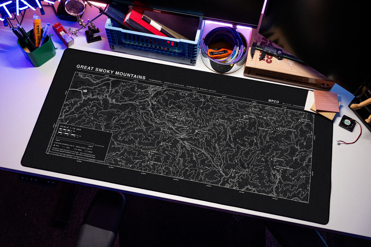 Great Smoky Mountains Topo Pad desk mat in Black / White, shown on a styled desk setup