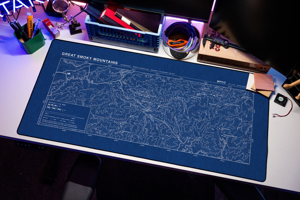 Great Smoky Mountains Topo Pad desk mat in Blue / White, shown on a styled desk setup