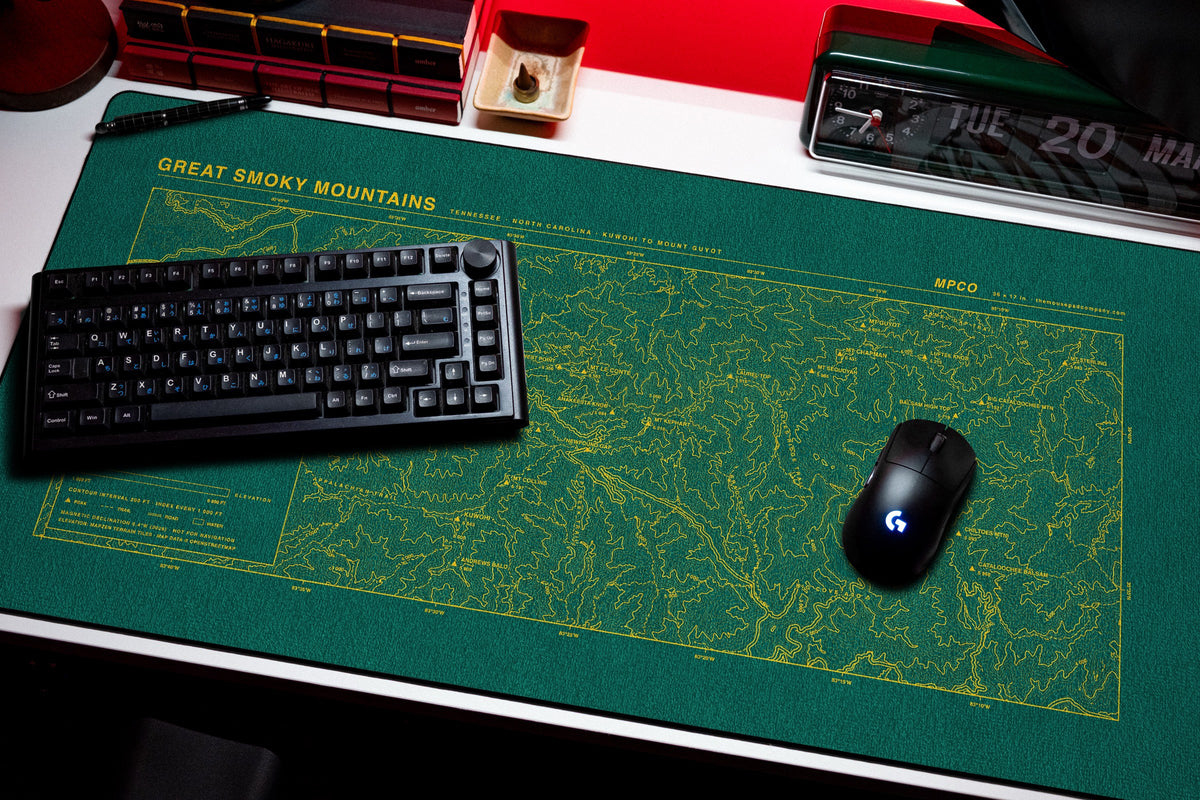 Great Smoky Mountains Topo Pad desk mat in Green / Yellow, shown on a styled desk setup