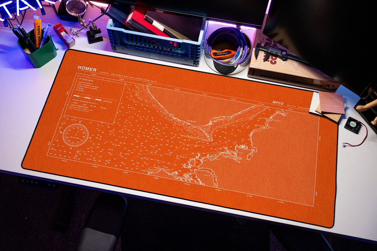 Homer Nautical Chart Pad desk mat in Orange / White, shown on a styled desk setup
