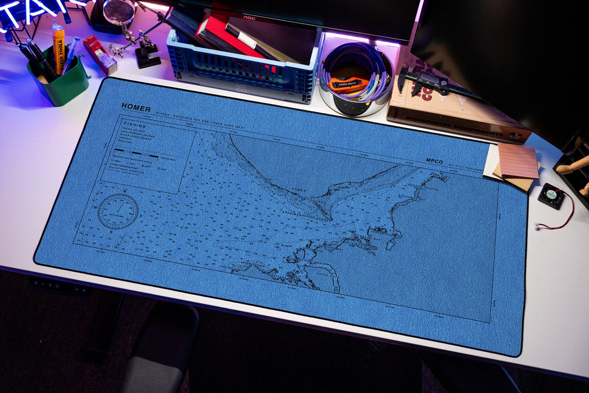 Homer Nautical Chart Pad desk mat in Swiss Blue, shown on a styled desk setup
