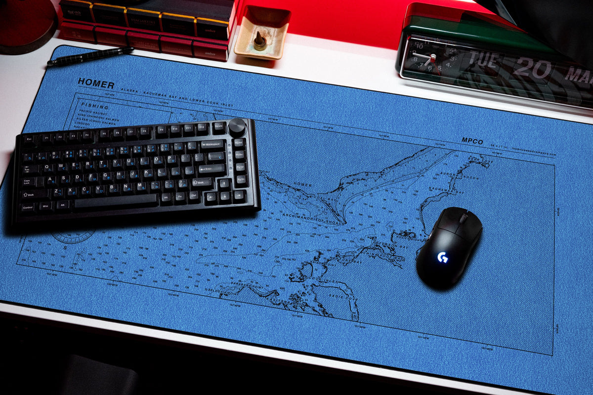 Homer Nautical Chart Pad desk mat in Swiss Blue, shown on a styled desk setup