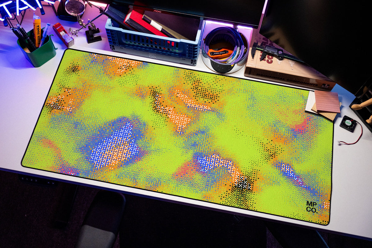Hot Pixel desk mat in Acid, shown on a styled desk setup