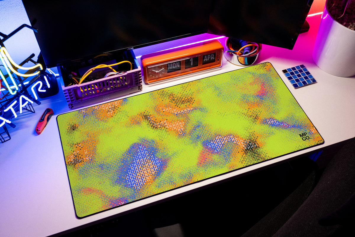 Hot Pixel desk mat in Acid, shown on a styled desk setup