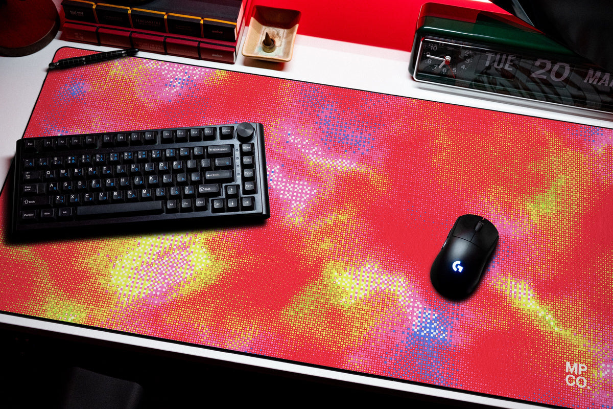 Hot Pixel desk mat in Cherry, shown on a styled desk setup