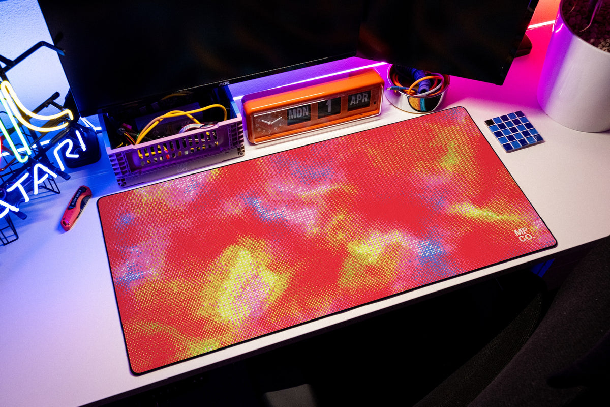 Hot Pixel desk mat in Cherry, shown on a styled desk setup