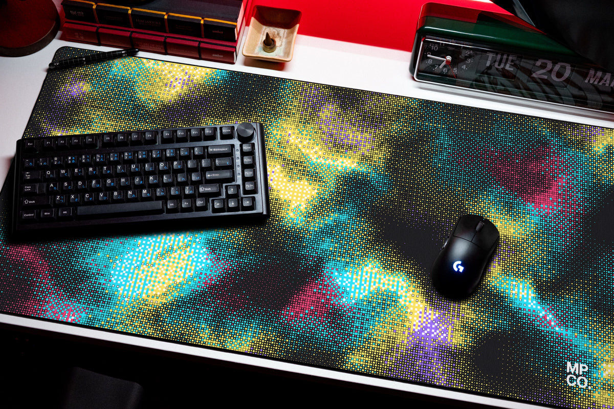 Hot Pixel desk mat in Midnight, shown on a styled desk setup
