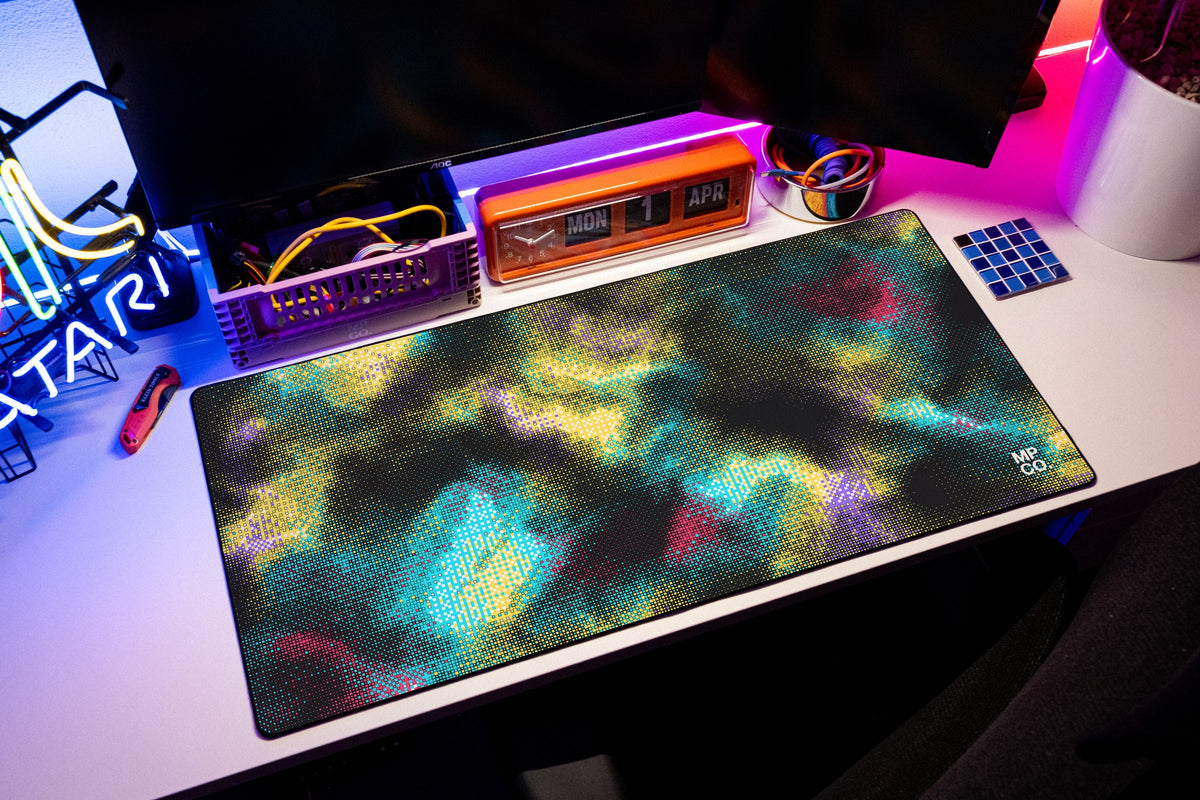 Hot Pixel desk mat in Midnight, shown on a styled desk setup