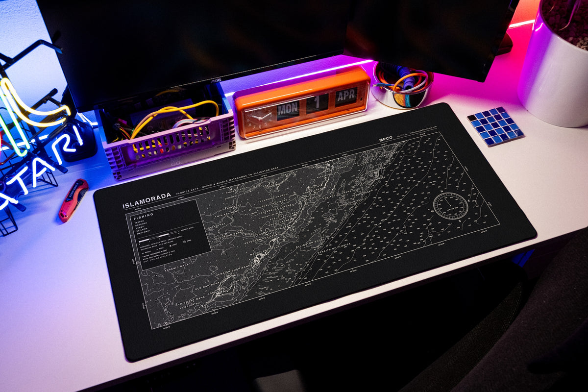 Islamorada Nautical Chart Pad desk mat in Black / White, shown on a styled desk setup