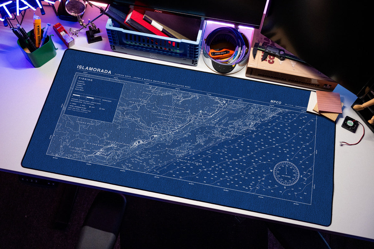 Islamorada Nautical Chart Pad desk mat in Blue / White, shown on a styled desk setup