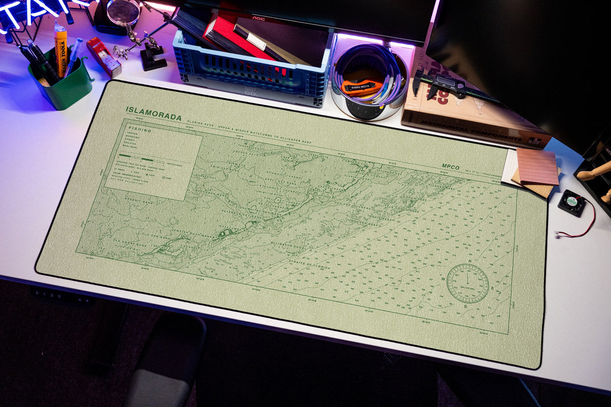 Islamorada Nautical Chart Pad desk mat in Buff / Green, shown on a styled desk setup