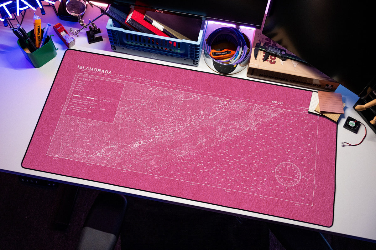 Islamorada Nautical Chart Pad desk mat in Pink / White, shown on a styled desk setup