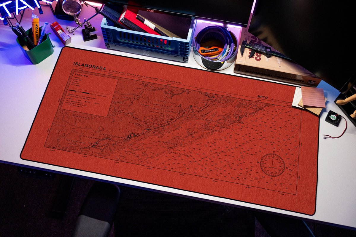 Islamorada Nautical Chart Pad desk mat in Red / Black, shown on a styled desk setup