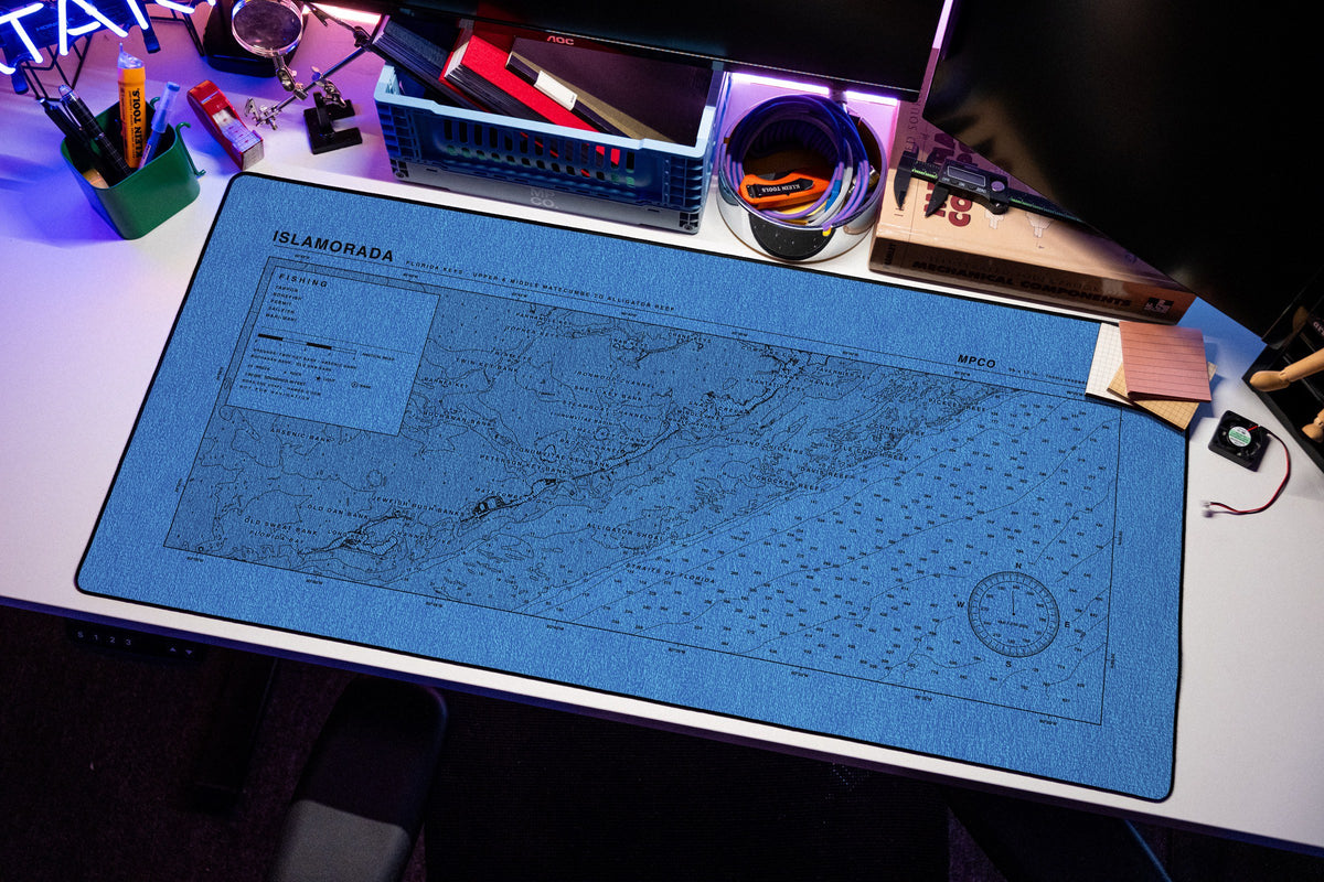 Islamorada Nautical Chart Pad desk mat in Swiss Blue, shown on a styled desk setup