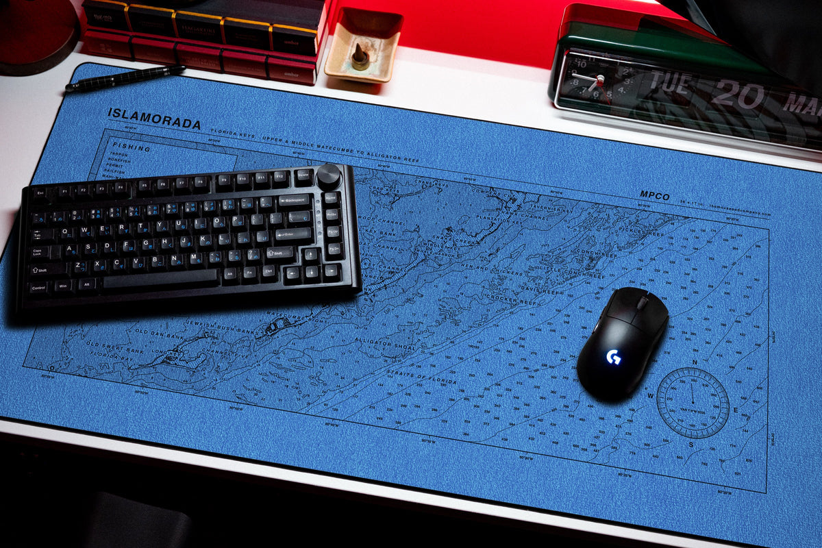 Islamorada Nautical Chart Pad desk mat in Swiss Blue, shown on a styled desk setup