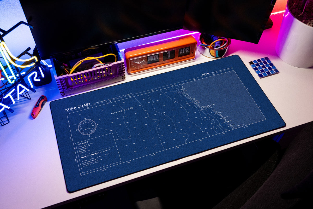Kona Coast Nautical Chart Pad desk mat in Blue / White, shown on a styled desk setup