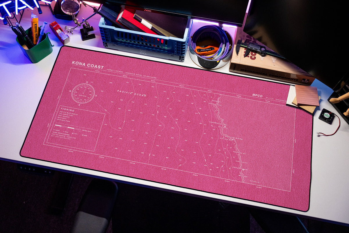 Kona Coast Nautical Chart Pad desk mat in Pink / White, shown on a styled desk setup