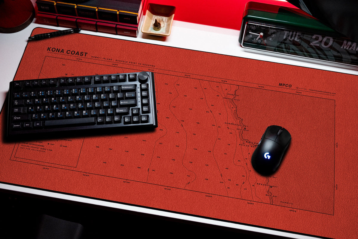 Kona Coast Nautical Chart Pad desk mat in Red / Black, shown on a styled desk setup
