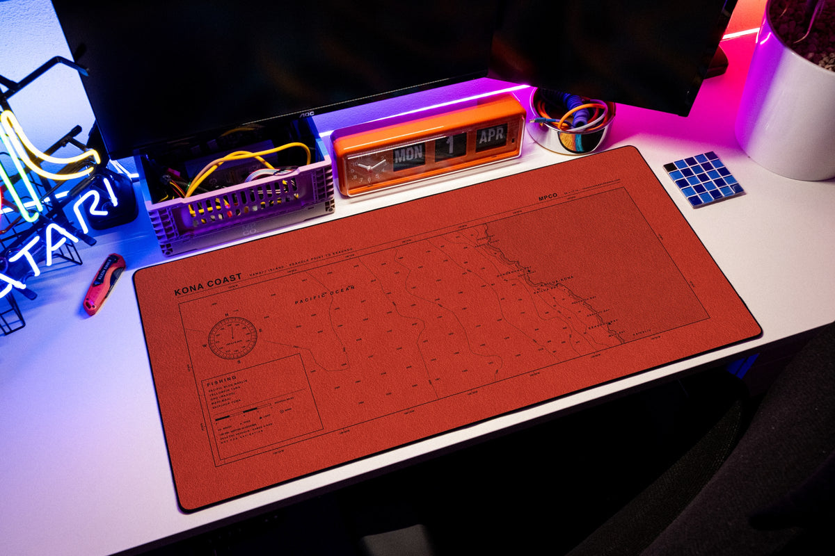 Kona Coast Nautical Chart Pad desk mat in Red / Black, shown on a styled desk setup