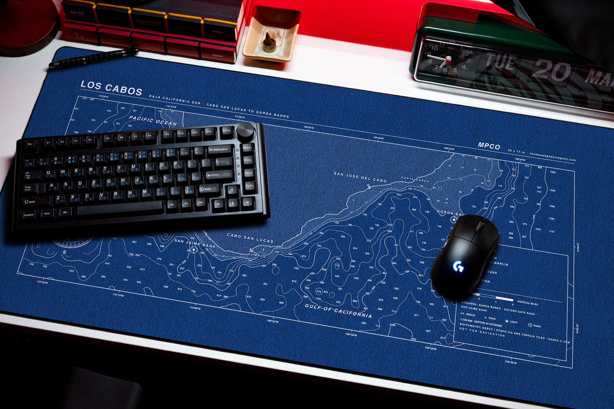Los Cabos Nautical Chart Pad desk mat in Blue / White, shown on a styled desk setup