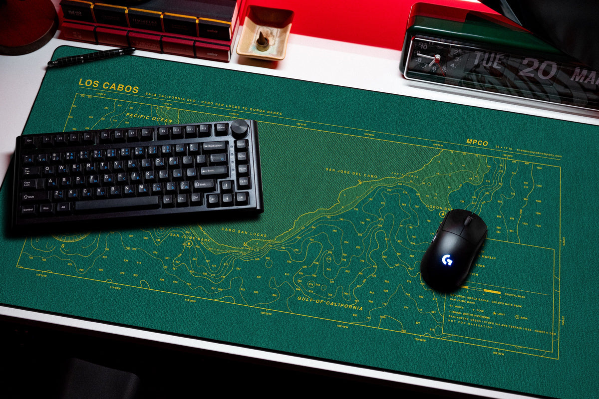 Los Cabos Nautical Chart Pad desk mat in Green / Yellow, shown on a styled desk setup