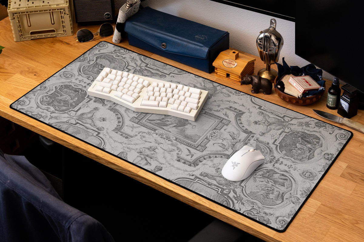 Martelli Hall desk mat in Dark, shown on a styled desk setup