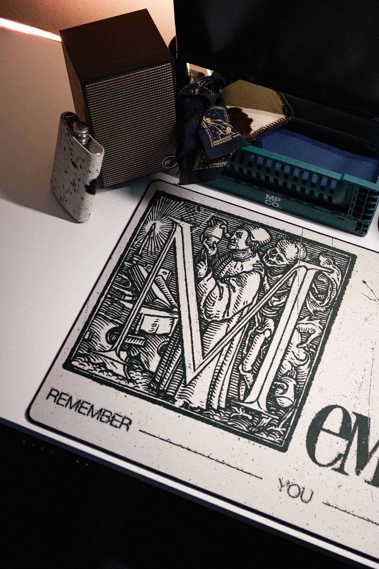 Memento Mori desk mat in Original, shown on a styled desk setup