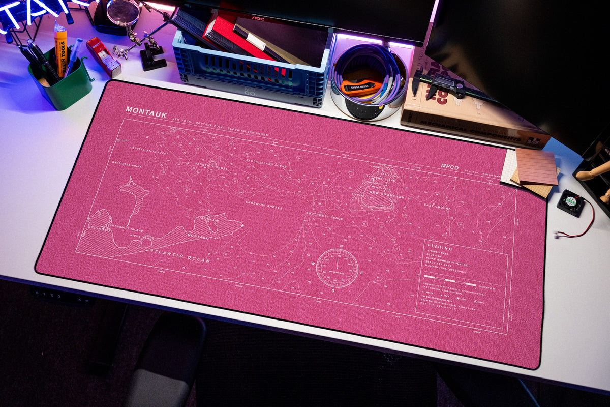 Montauk Nautical Chart Pad desk mat in Pink / White, shown on a styled desk setup