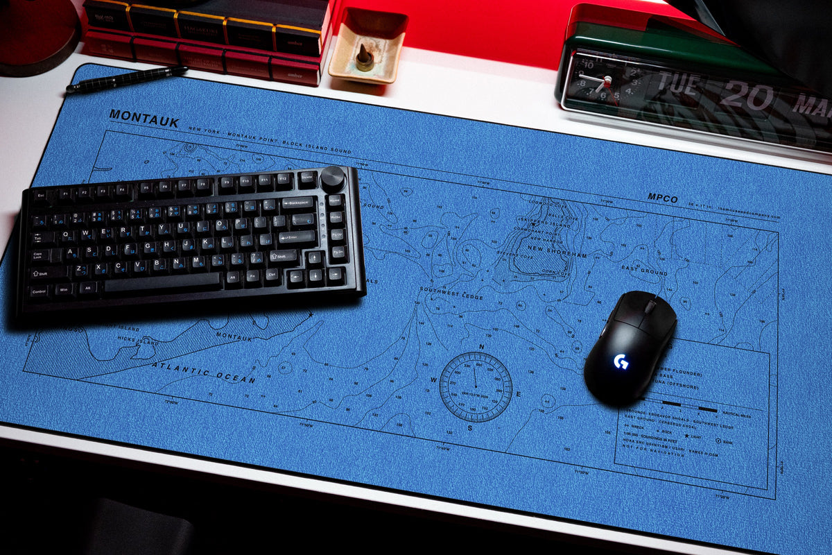 Montauk Nautical Chart Pad desk mat in Swiss Blue, shown on a styled desk setup