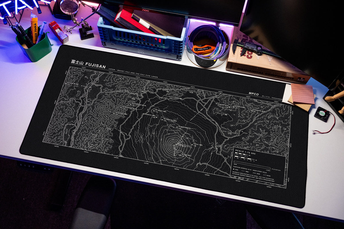 Mount Fuji Topo Pad desk mat in Black / White, shown on a styled desk setup