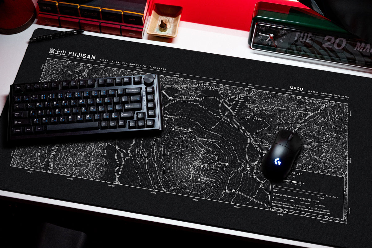 Mount Fuji Topo Pad desk mat in Black / White, shown on a styled desk setup