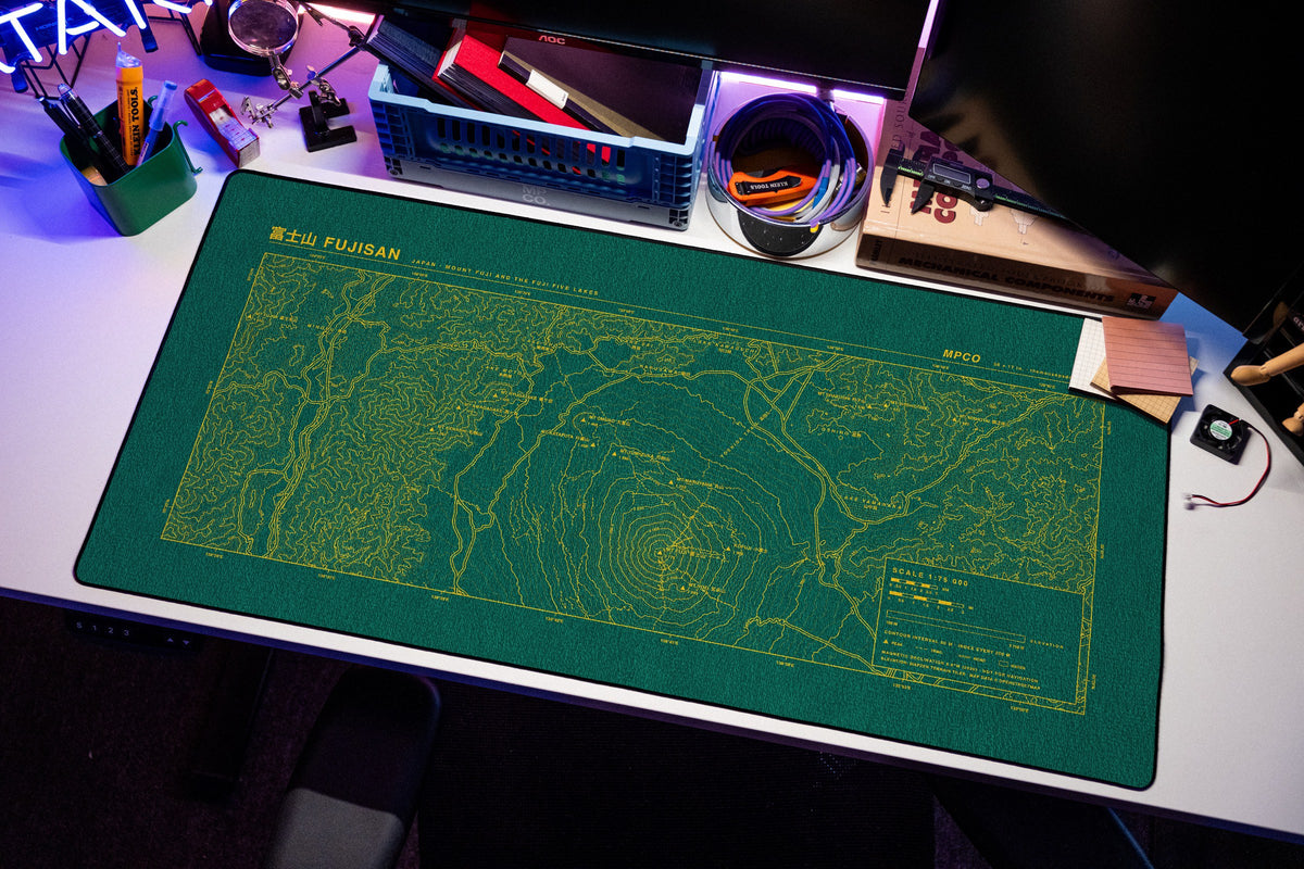 Mount Fuji Topo Pad desk mat in Green / Yellow, shown on a styled desk setup