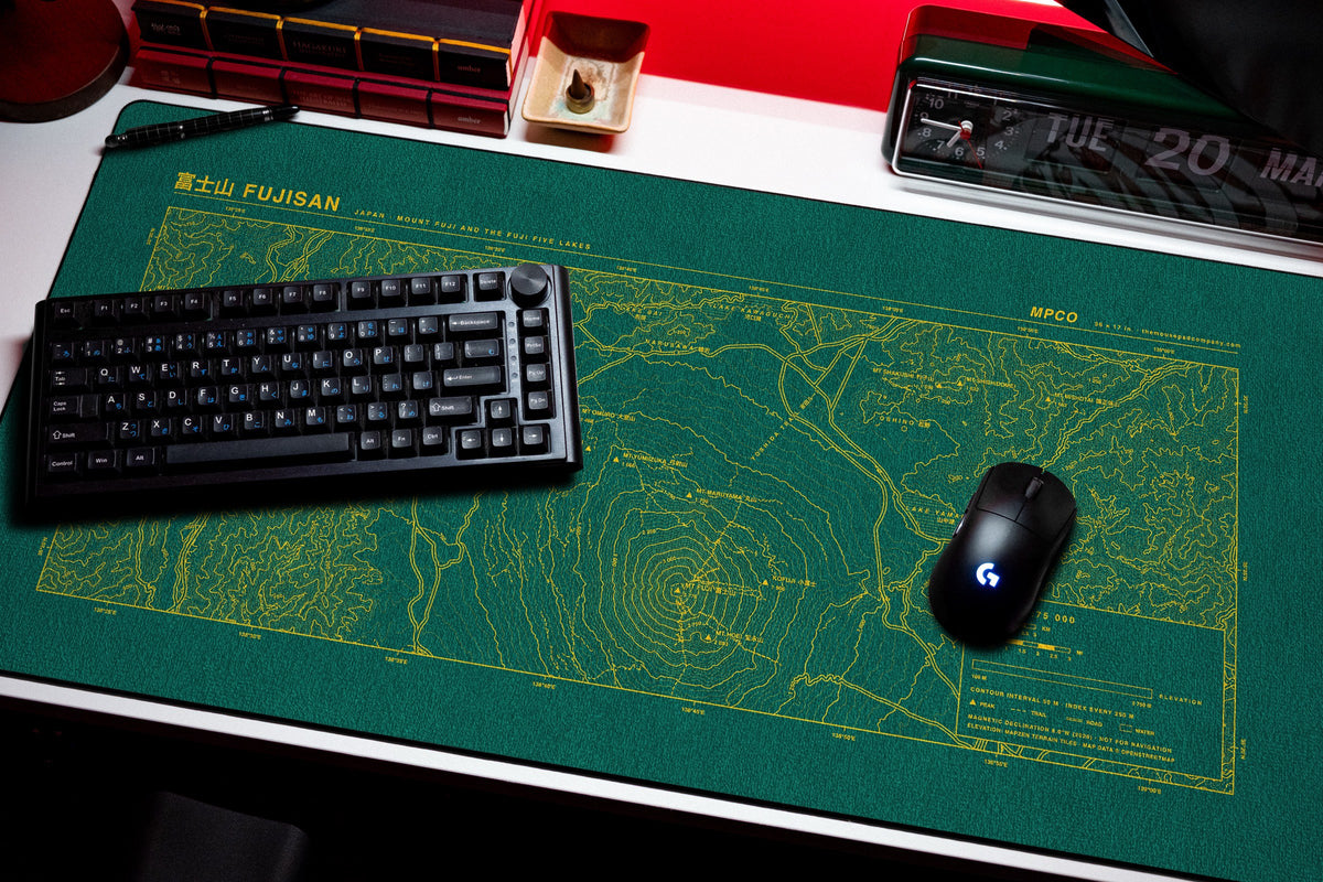 Mount Fuji Topo Pad desk mat in Green / Yellow, shown on a styled desk setup