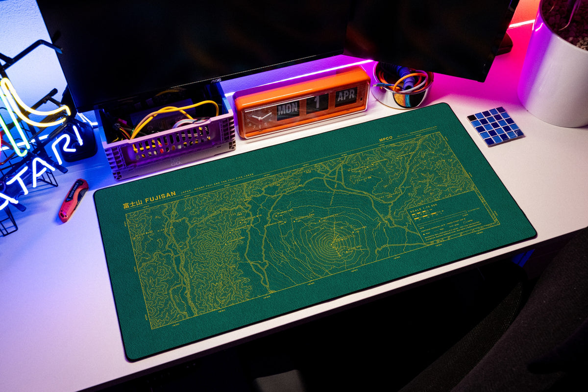 Mount Fuji Topo Pad desk mat in Green / Yellow, shown on a styled desk setup
