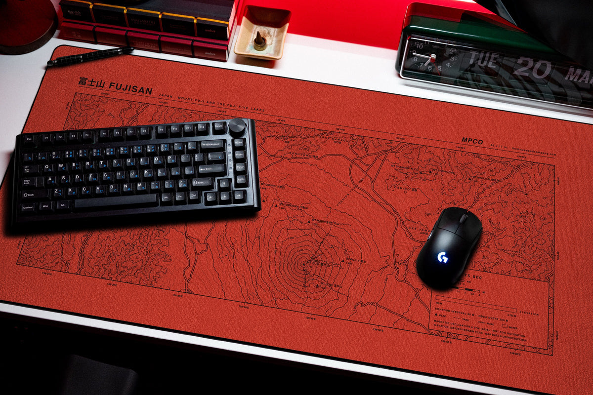 Mount Fuji Topo Pad desk mat in Red / Black, shown on a styled desk setup