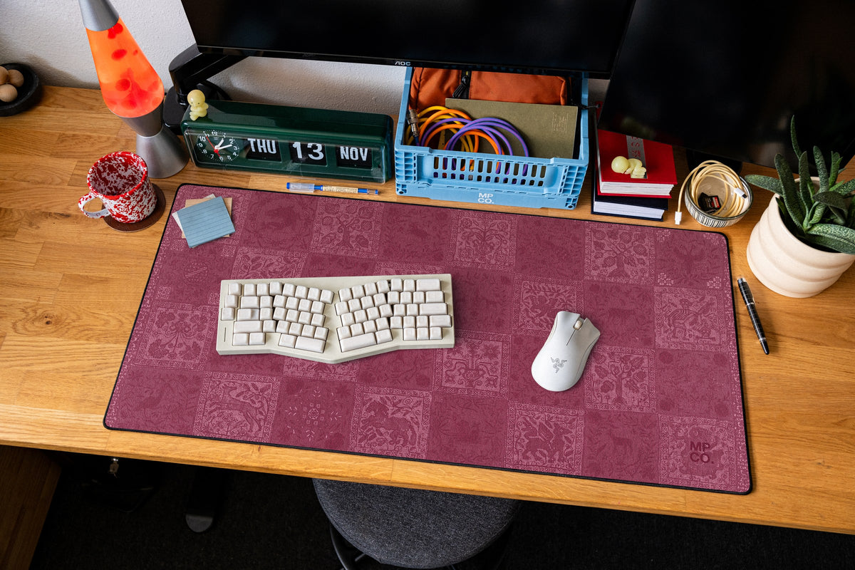 Mystic Sampler desk mat in Rouge, shown on a styled desk setup