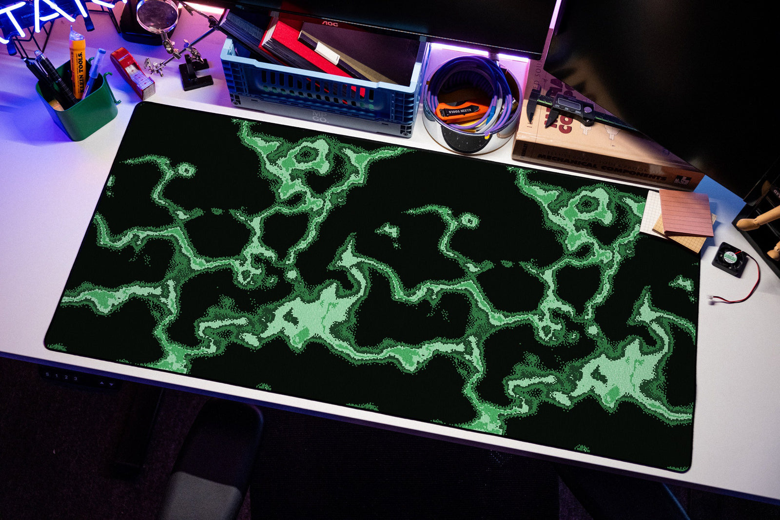 Neon desk mat in Green, shown on a styled desk setup
