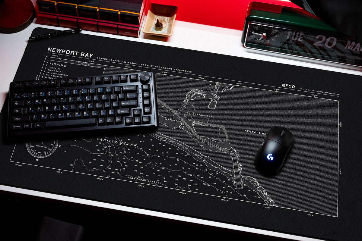 Newport Bay Nautical Chart Pad desk mat in Black / White, shown on a styled desk setup