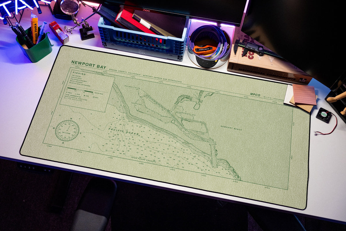 Newport Bay Nautical Chart Pad desk mat in Buff / Green, shown on a styled desk setup