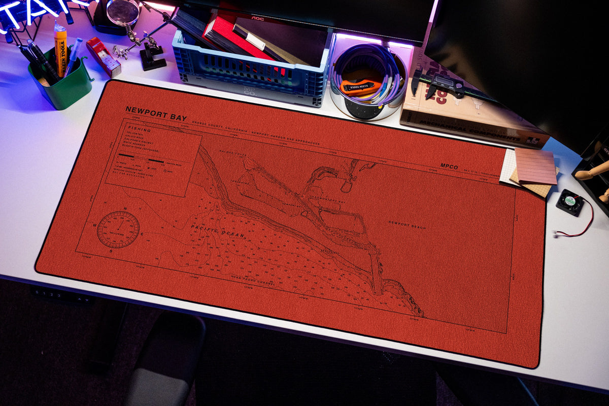 Newport Bay Nautical Chart Pad desk mat in Red / Black, shown on a styled desk setup
