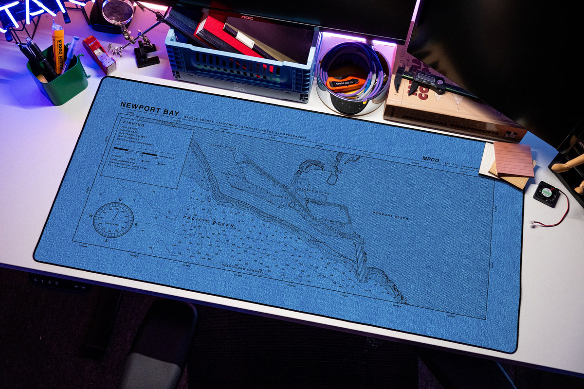 Newport Bay Nautical Chart Pad desk mat in Swiss Blue, shown on a styled desk setup