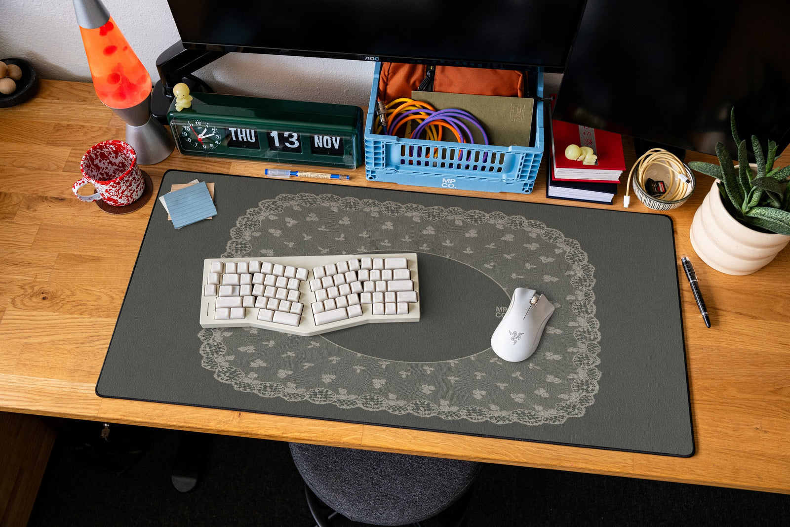 Oval Veil desk mat in Charcoal, shown on a styled desk setup