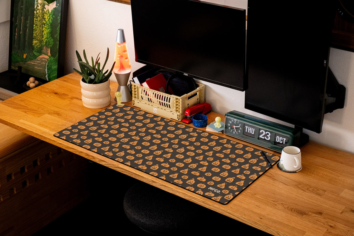 Pumpkin Patch desk mat in Black, shown on a styled desk setup