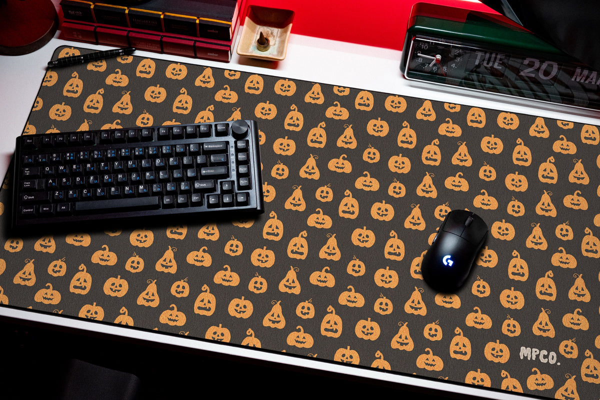 Pumpkin Patch desk mat in Black, shown on a styled desk setup