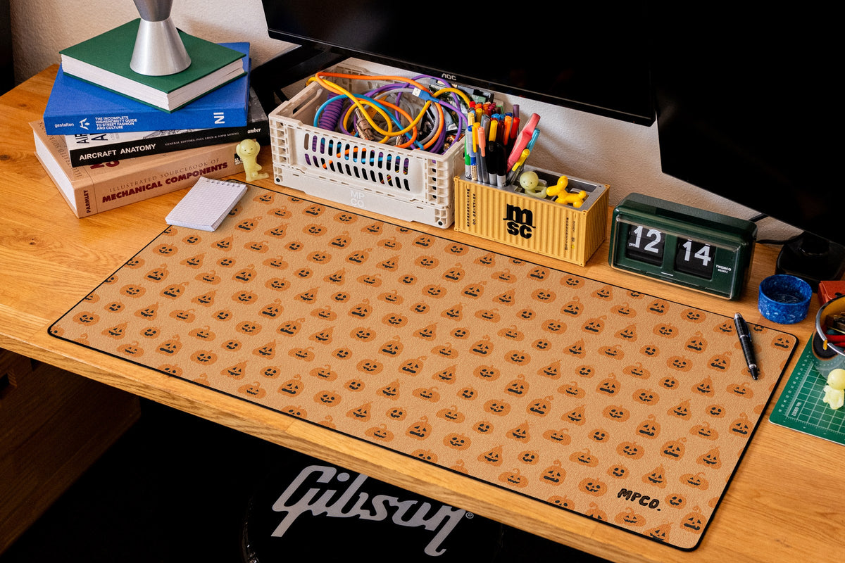 Pumpkin Patch desk mat in Orange, shown on a styled desk setup