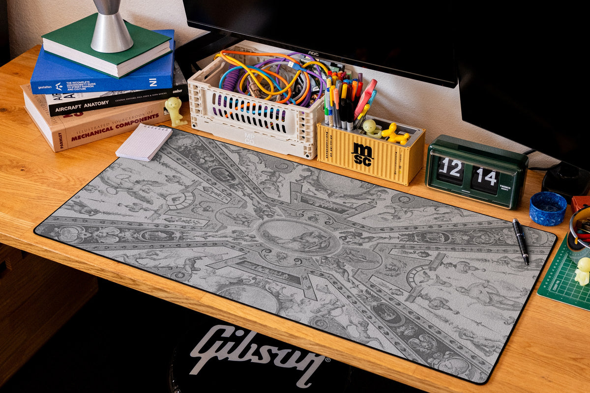 Reclining Allegory desk mat in Dark, shown on a styled desk setup
